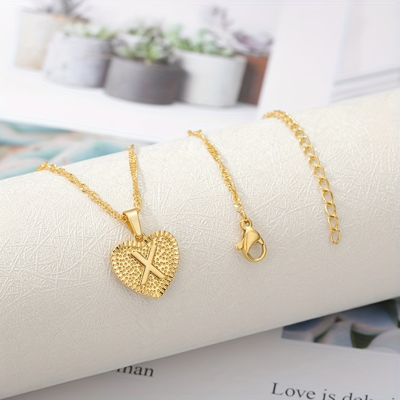 from The Heart Jewelry Cross and Initial Charm Bracelet