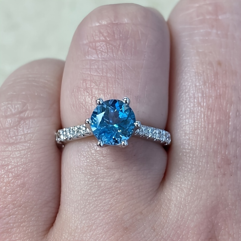 Blue moissanite engagement on sale rings