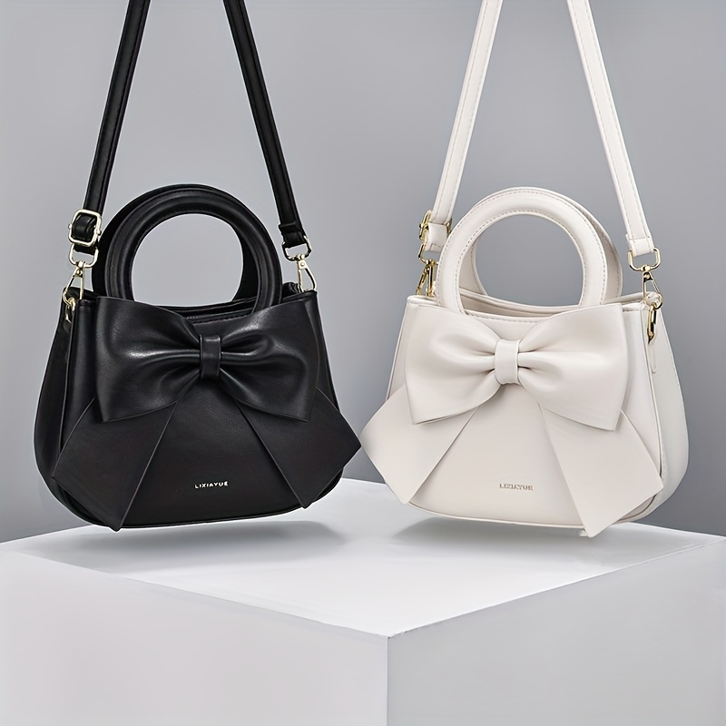 KNOT BAG - LEATHER TOP HANDLE BAG WITH CROSSBODY STRAP in black