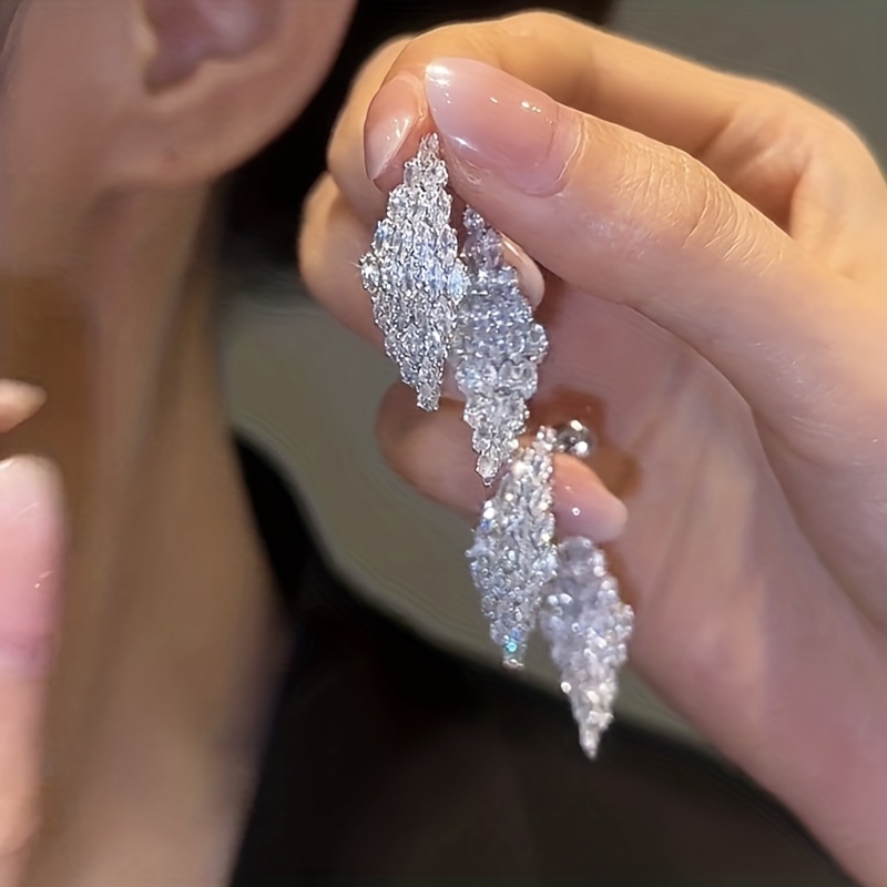 

Boucles d'oreilles décorées de zircones Bling Bling en forme de losange, à porter sur le devant et le dos, pour les fêtes, les banquets et les rendez-vous.