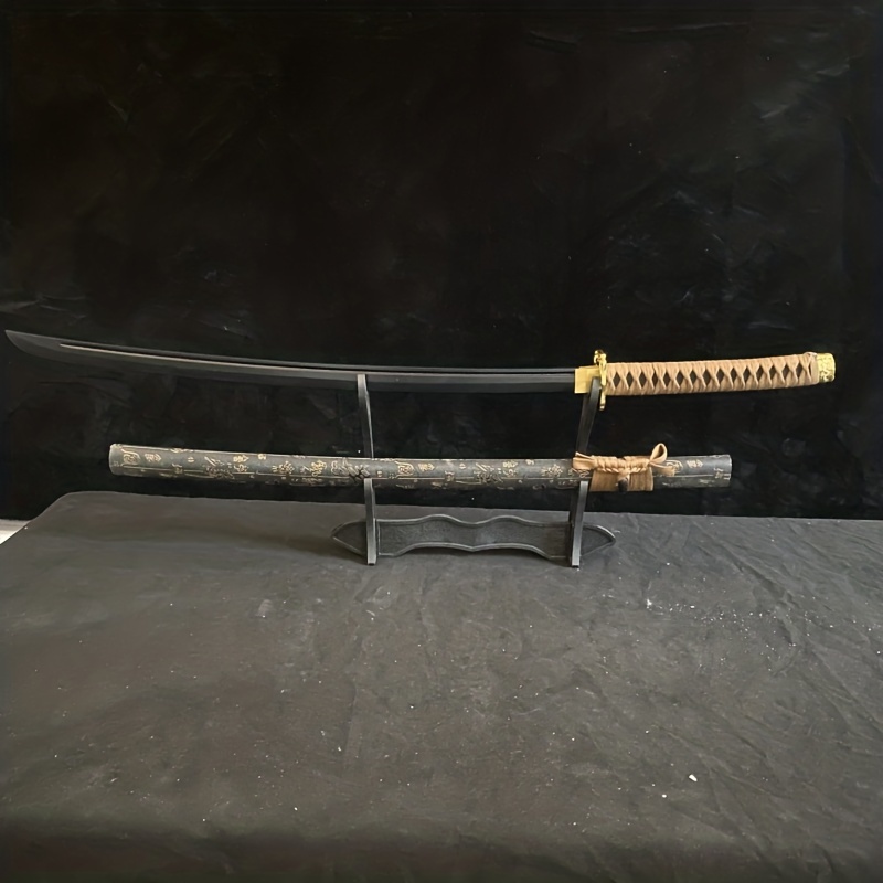 Image of an anime character in a black and gold outfit with a katana