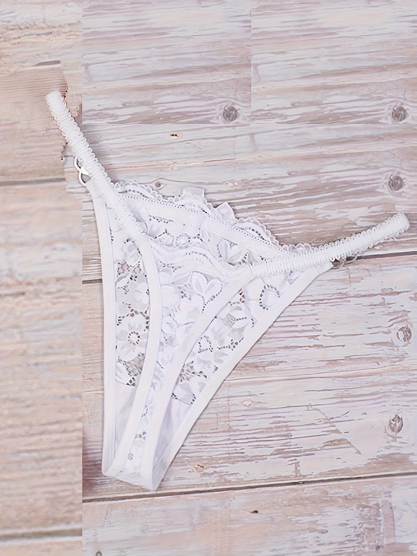 Lingerie. Women`s Lacy Underwear with a Bust and Panties on Wooden