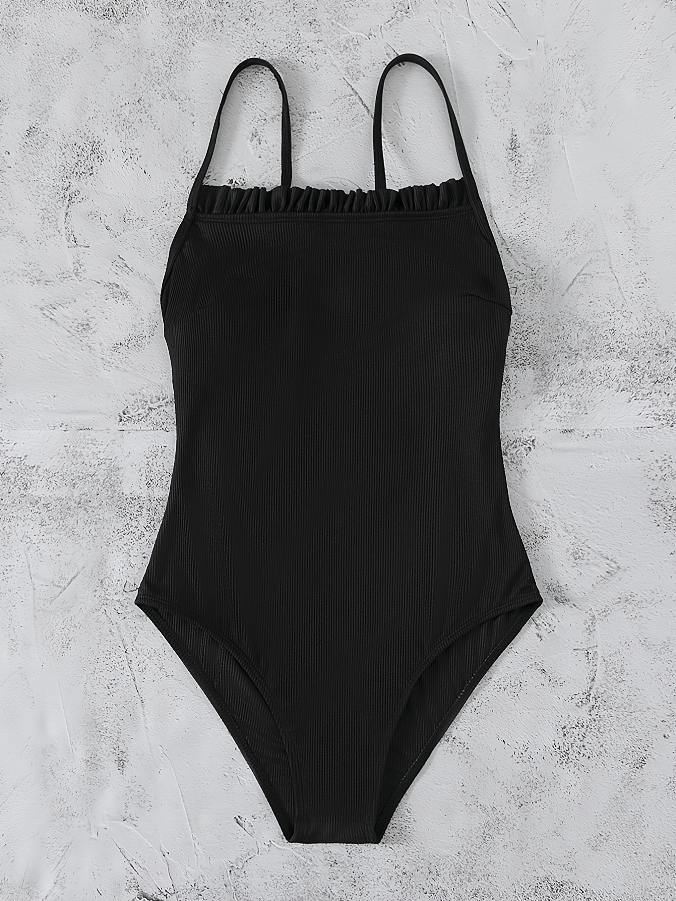 black bathing suit with white trim