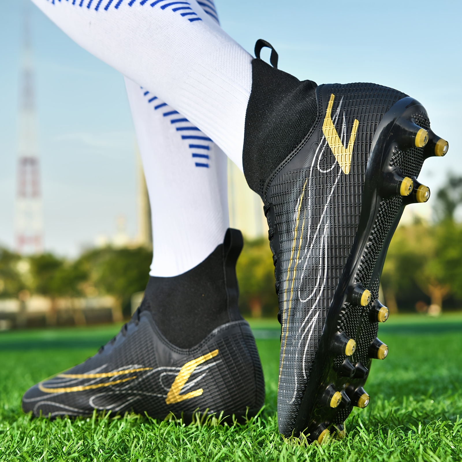 Boys black and store gold football cleats