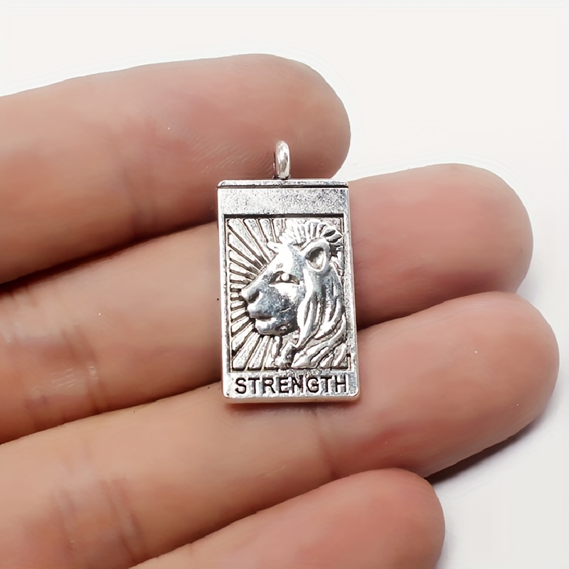 Witch shaped pendant in silver.