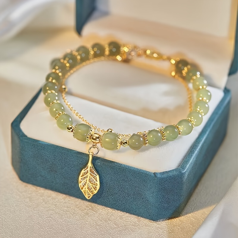 Golden Tone Leaf Charm Bracelet with Green Beads