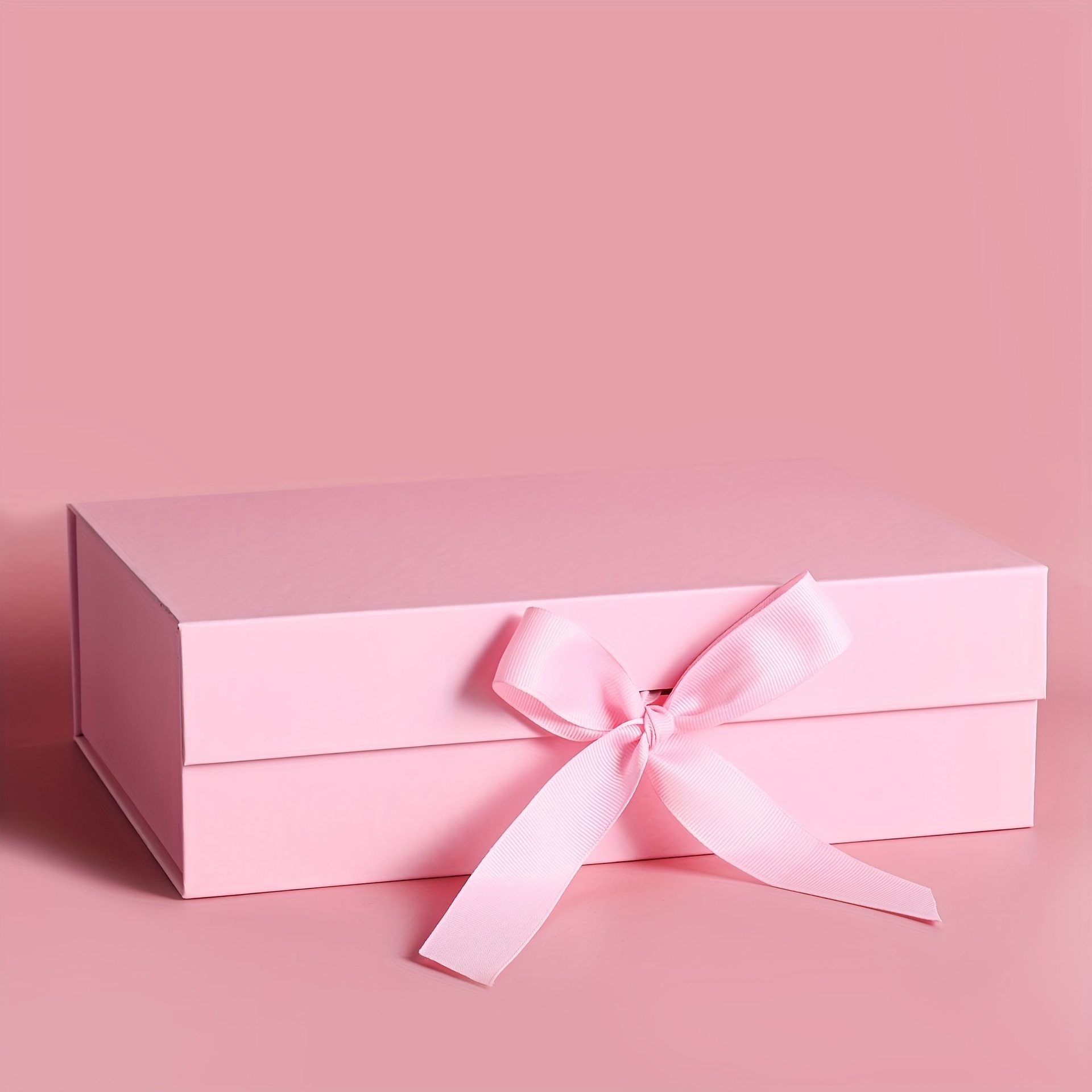 Close up of pink and red ribbon tied around box of luxury white chocolates  Stock Photo - Alamy