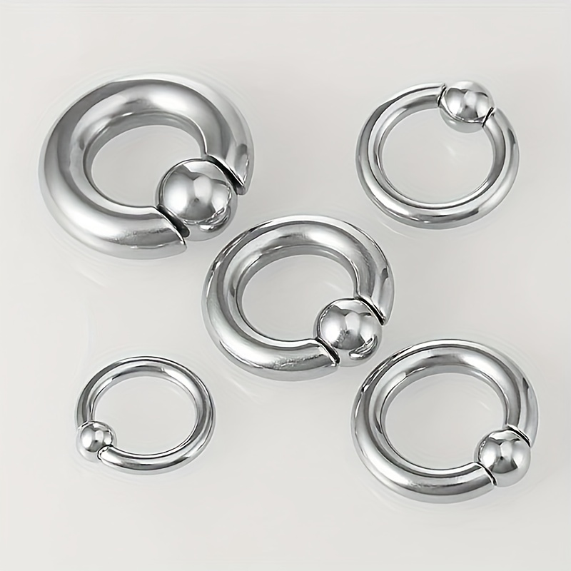 Five Rings That Are Hypoallergenic And Versatile, Including a Thick Brass Nose Ring with a Spring Ball Design, Suitable for Men's Earrings And Lip Rings.