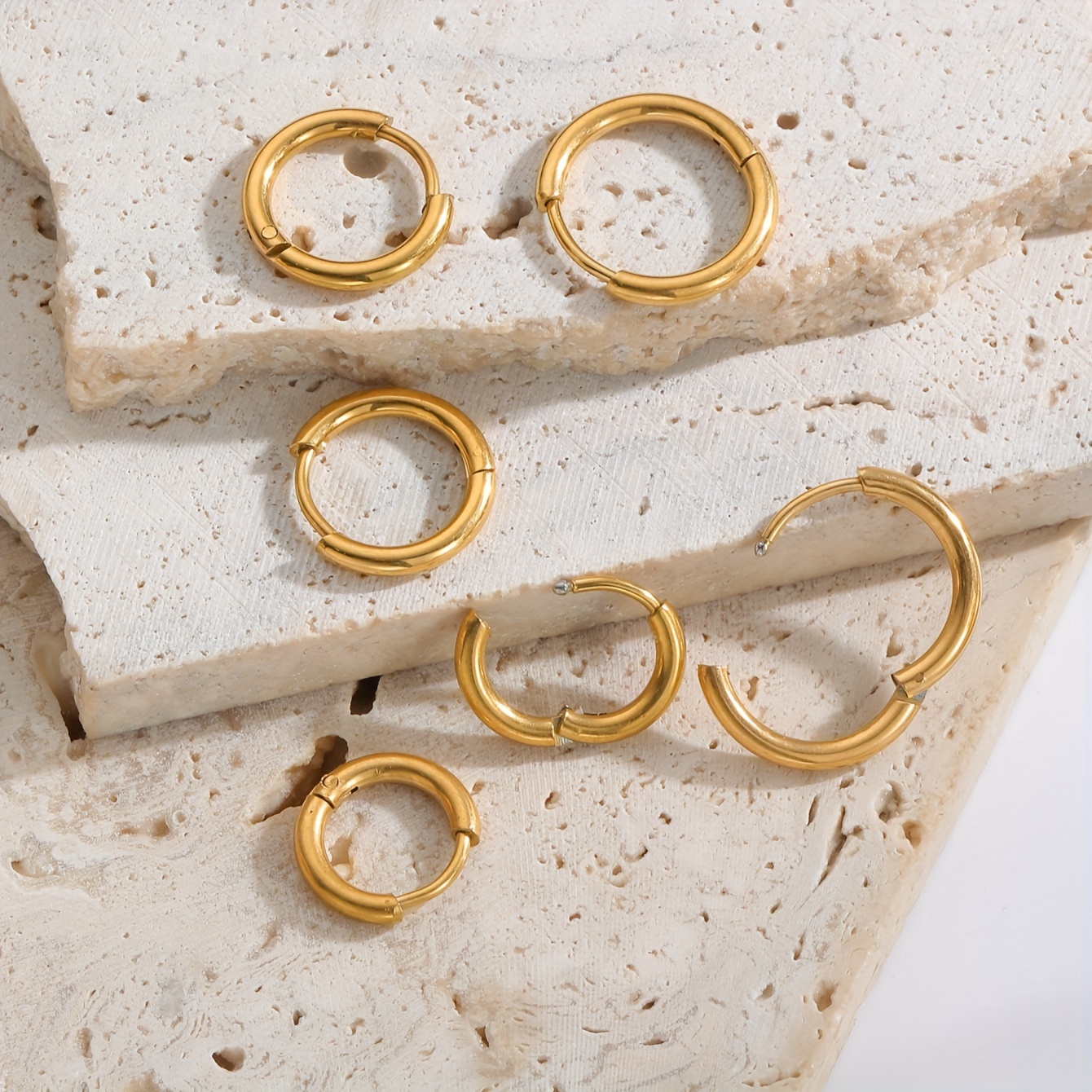 

Pairs Of Minimalist And Unique Stainless Steel Hoop Earrings Suitable For Women To Wear , At Parties, Or For Use.