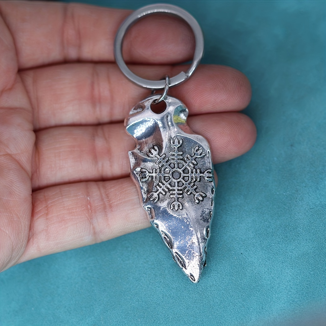 Silver keychain with helm.