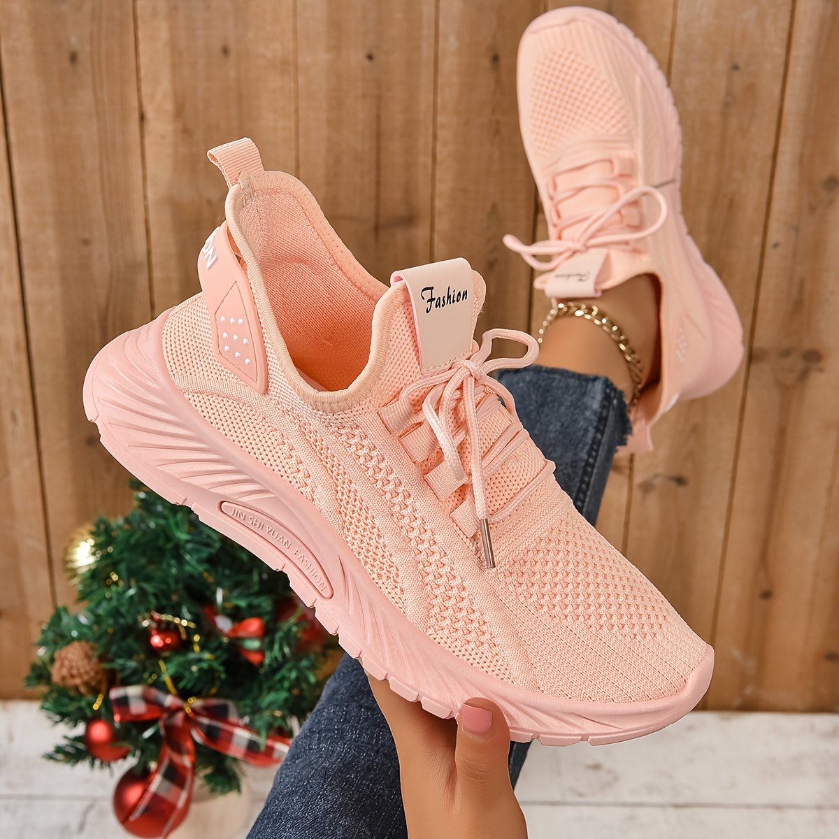 women peach knitted lace-up sports shoe