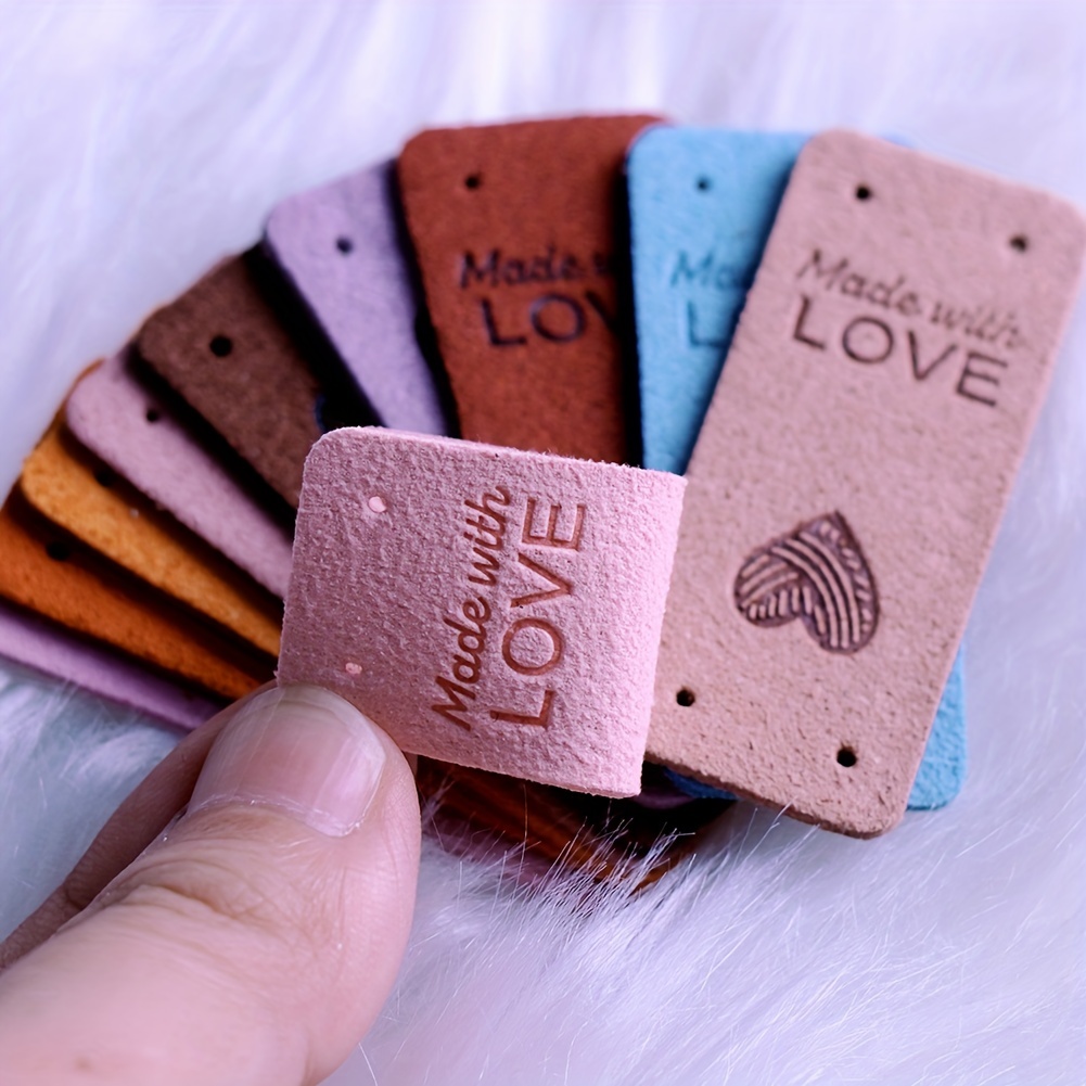  50 Pcs Leather Handmade Labels,PU Leather Tags for Crochet  Accessories Folding Handmade Tags Knit Accessories with Holes Embossed Tag  Embellishment Knit DIY Apparel Accessories for Jeans Bag Shoes Hat 