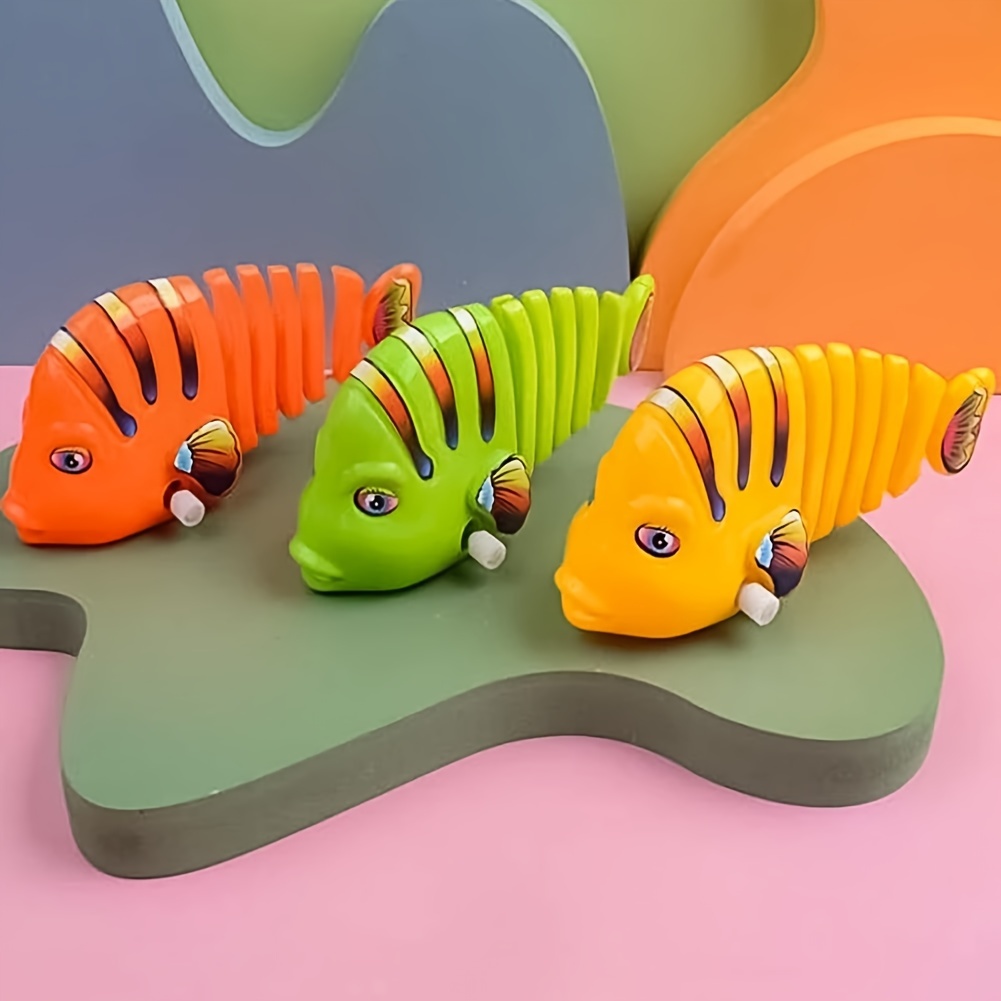 12 juguetes de peces de plástico para enrollar, juguetes de peces de  dibujos animados oscilantes, juguetes creativos de cuerda para niños,  juguetes