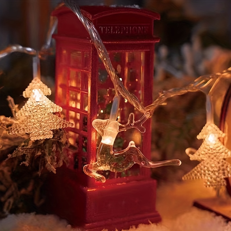 Maison de Noël décorative avec guirlandes lumineuses - Mirto