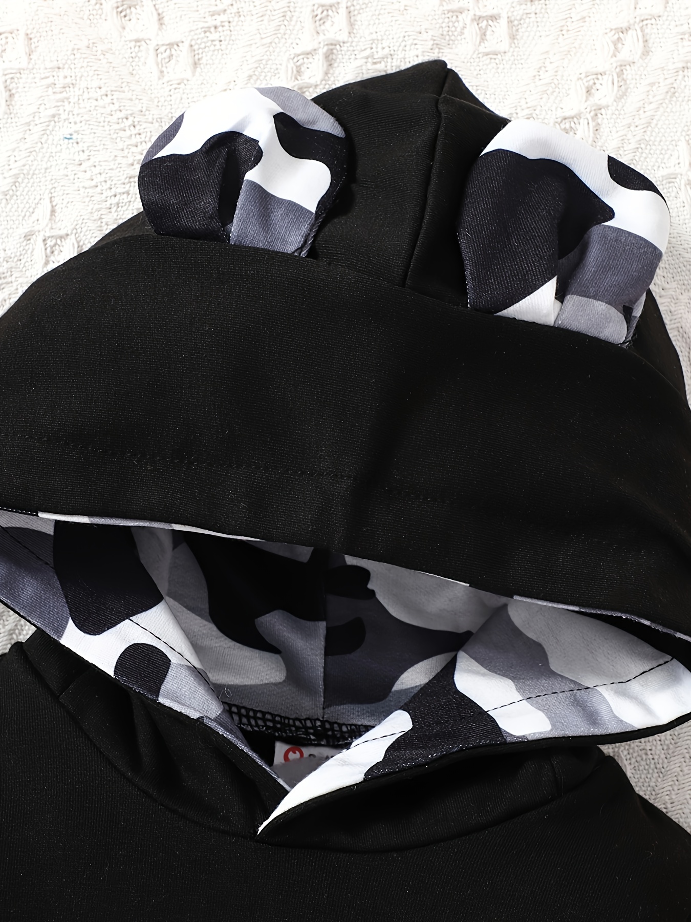 Baby- en peuterrompertje met capuchon en hartjesprint