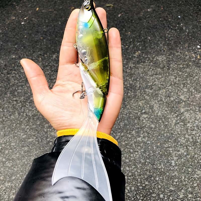 Fishing tackle. Float, wobbler, bait hooks, on a wooden background.  Selective focus Stock Photo by solovei23