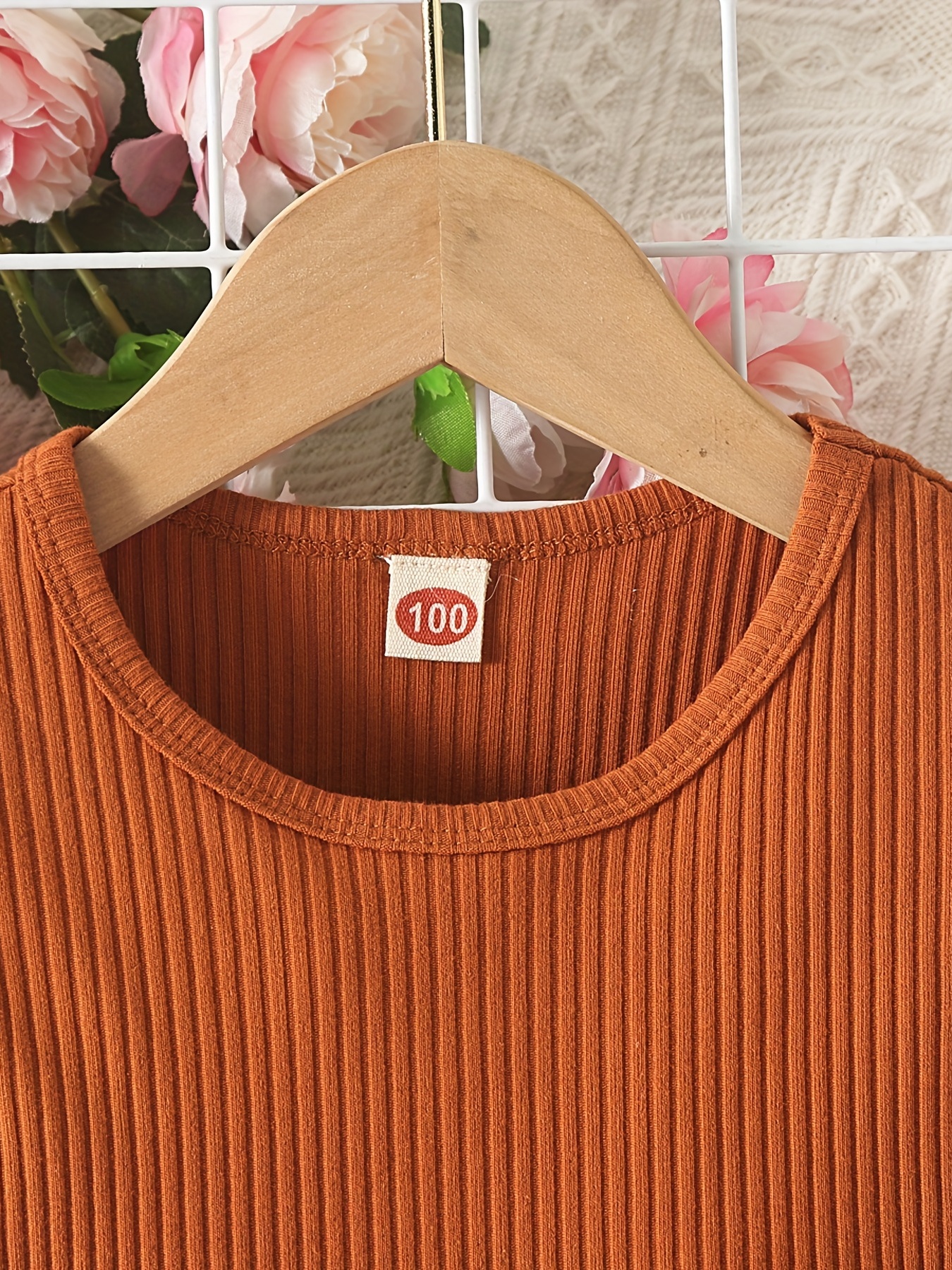 Fashion shop logo - Orange Clothes hanger and dress and butterfly