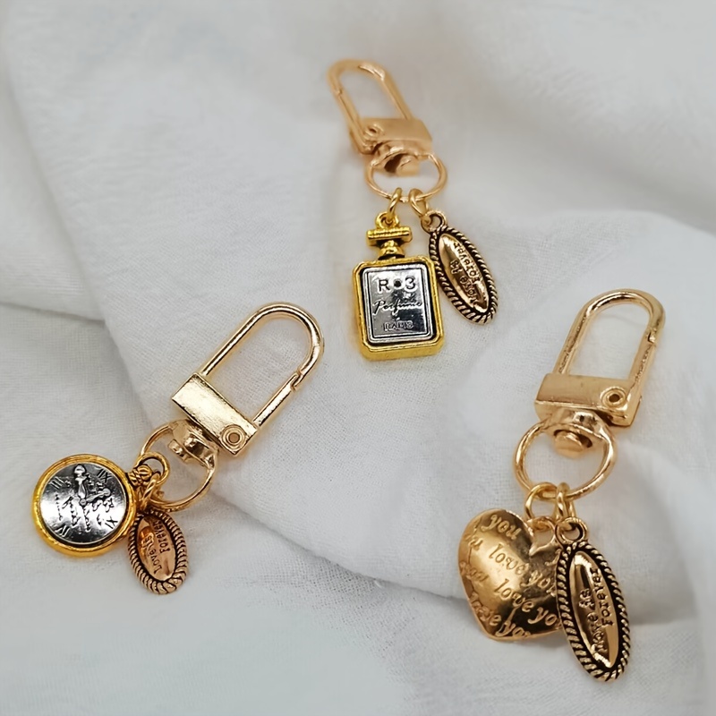 Temu Cute Perfume Bottle Keychain Golden Alloy Key Chain Ring Purse Bag Backpack Charm Earbud Case Cover Accessories Women, Christmas Styling & Gift