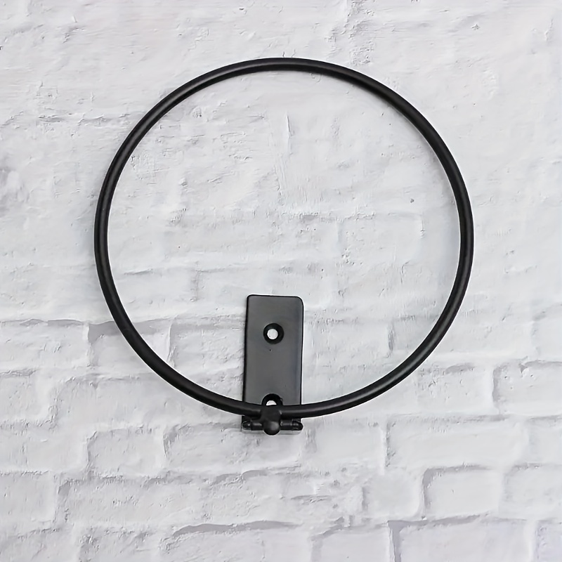 Two plant pot ring mounted on the wall.