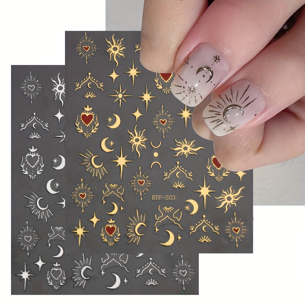 Gold moon and stars nail tattoos