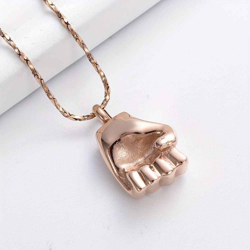 Gold hot sale fist pendant