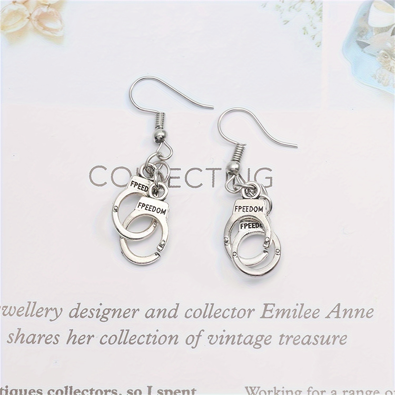 Dangling on sale handcuff earrings