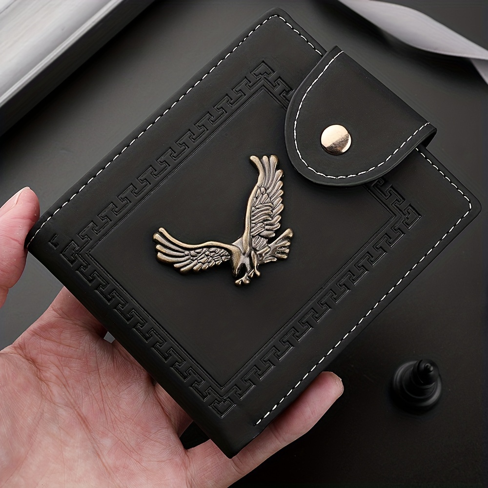 Leather coin-pocket wallet with all-over embossed eagle
