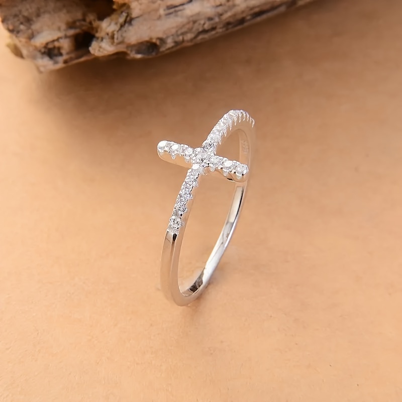 A Stylish And Minimalist Cross Ring for Women Featuring Micro-Set Zirconia Stones Perfect for Daily Wear Casual Parties Engagements Weddings And As a Commitment Gift