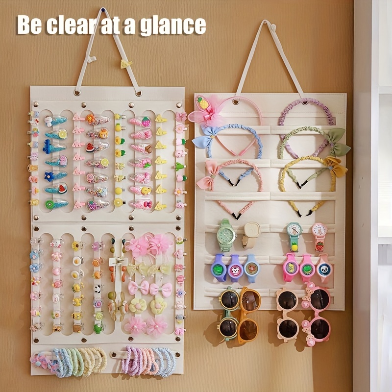 

Organize Your Little Girl's Hair Accessories With This Wall-mounted Storage Bag!