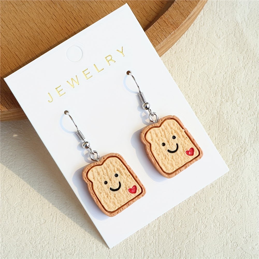 Smiley face store dangle earrings