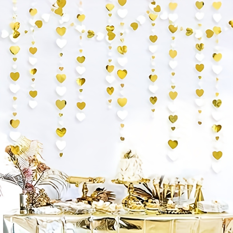 Decorative Gold Party Streamers Hanging Over White Background