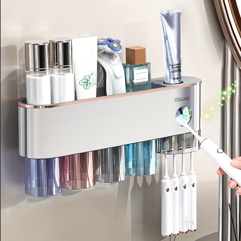 Accesorios de baño de plástico con 4 tazas y magnéticos en la pared Porta  Cepillo dispensador automático de la pasta de dientes exprimidor - China La  pasta de dientes exprimidor dispensador y