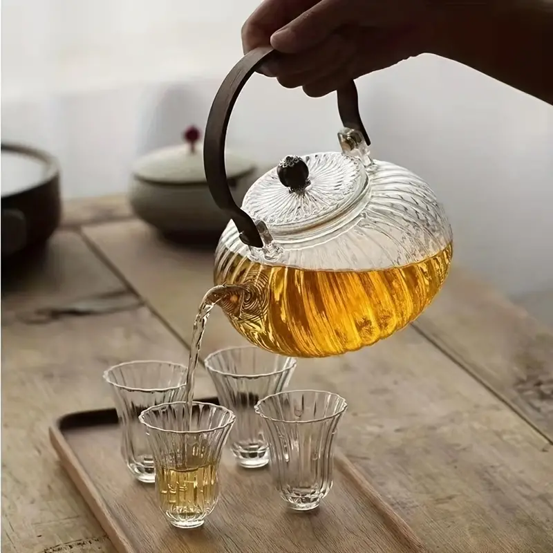 Acquista Teiera in vetro con manico in legno Teiera cinese in vetro  resistente al calore Tè fumante trasparente Bollitore in vetro Set da tè  Infusore per tè