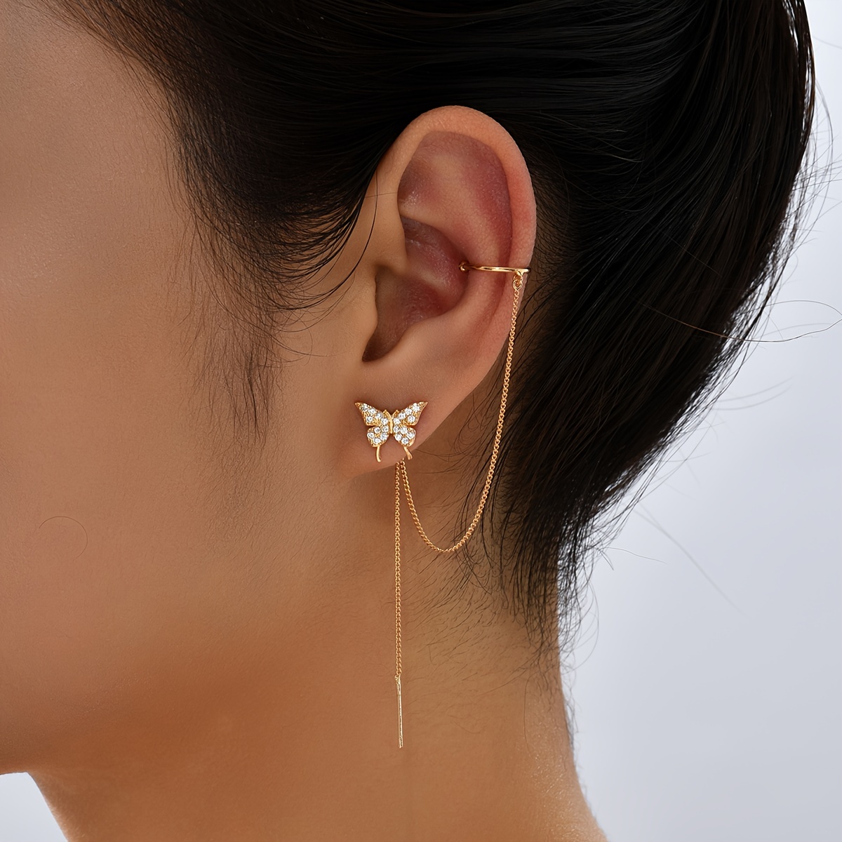 

Elegant Golden-tone Ear Cuff With Sparkling Zirconia Stones And Tassel Accents - Chic Ear Clip For Women, Ideal For Weddings And