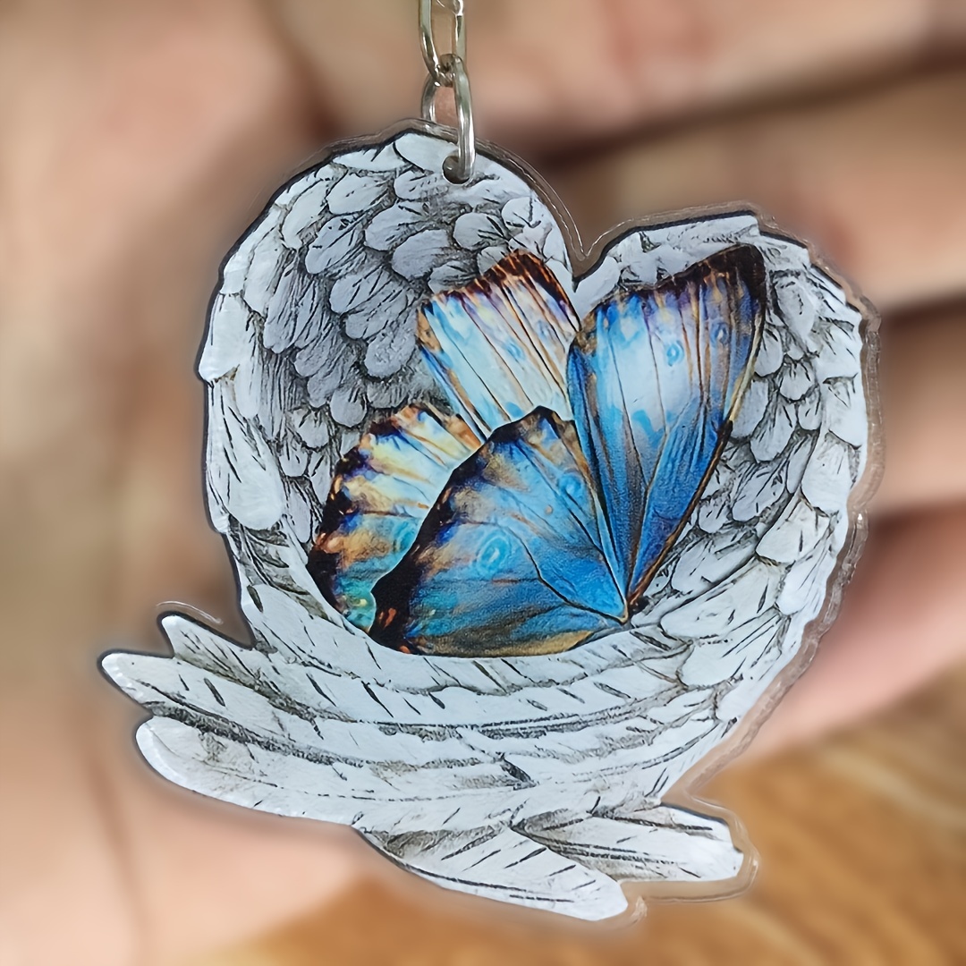 Porte-clés bijou de sac ailes d'ange argenté