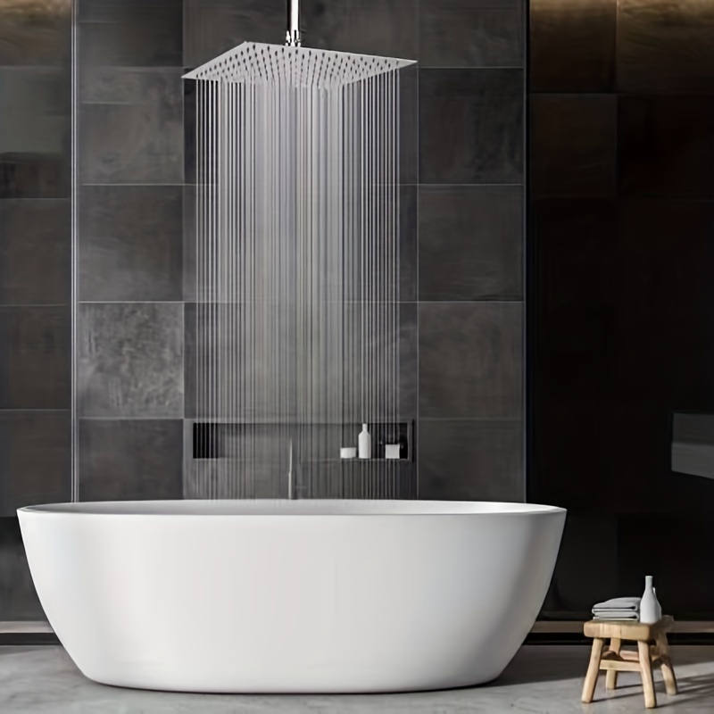 A luxury stand up grey marble shower with a rain shower head with