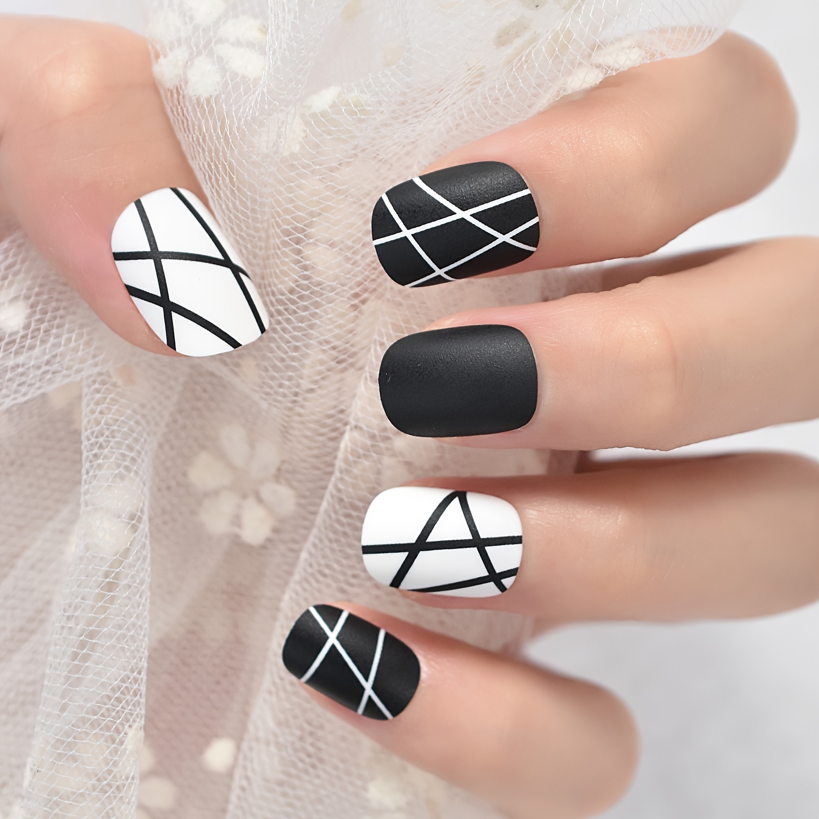 Full set of stiletto nails with black and white nail art | Flickr