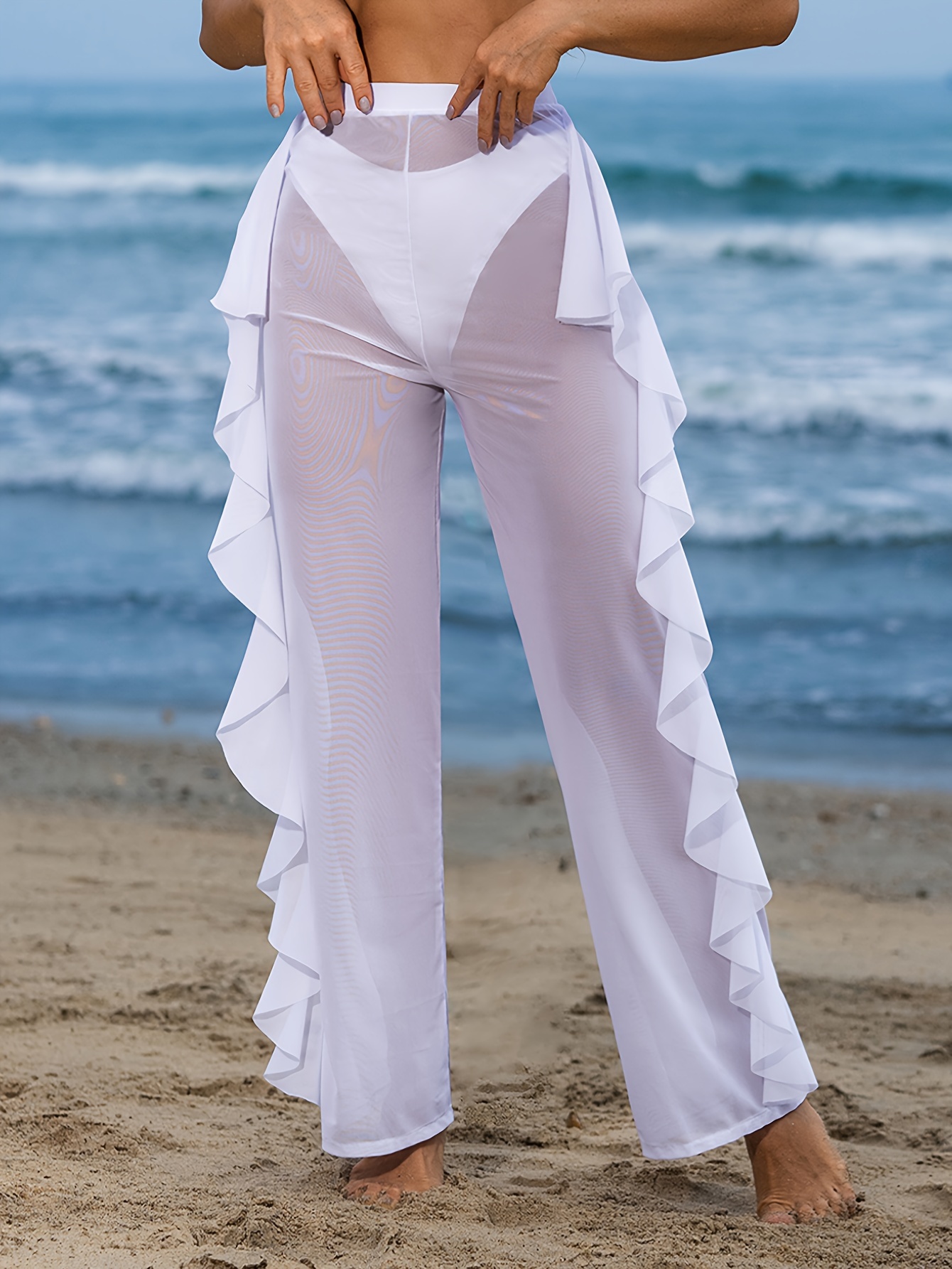 Pantalones de playa de malla de punto transparente con volantes en
