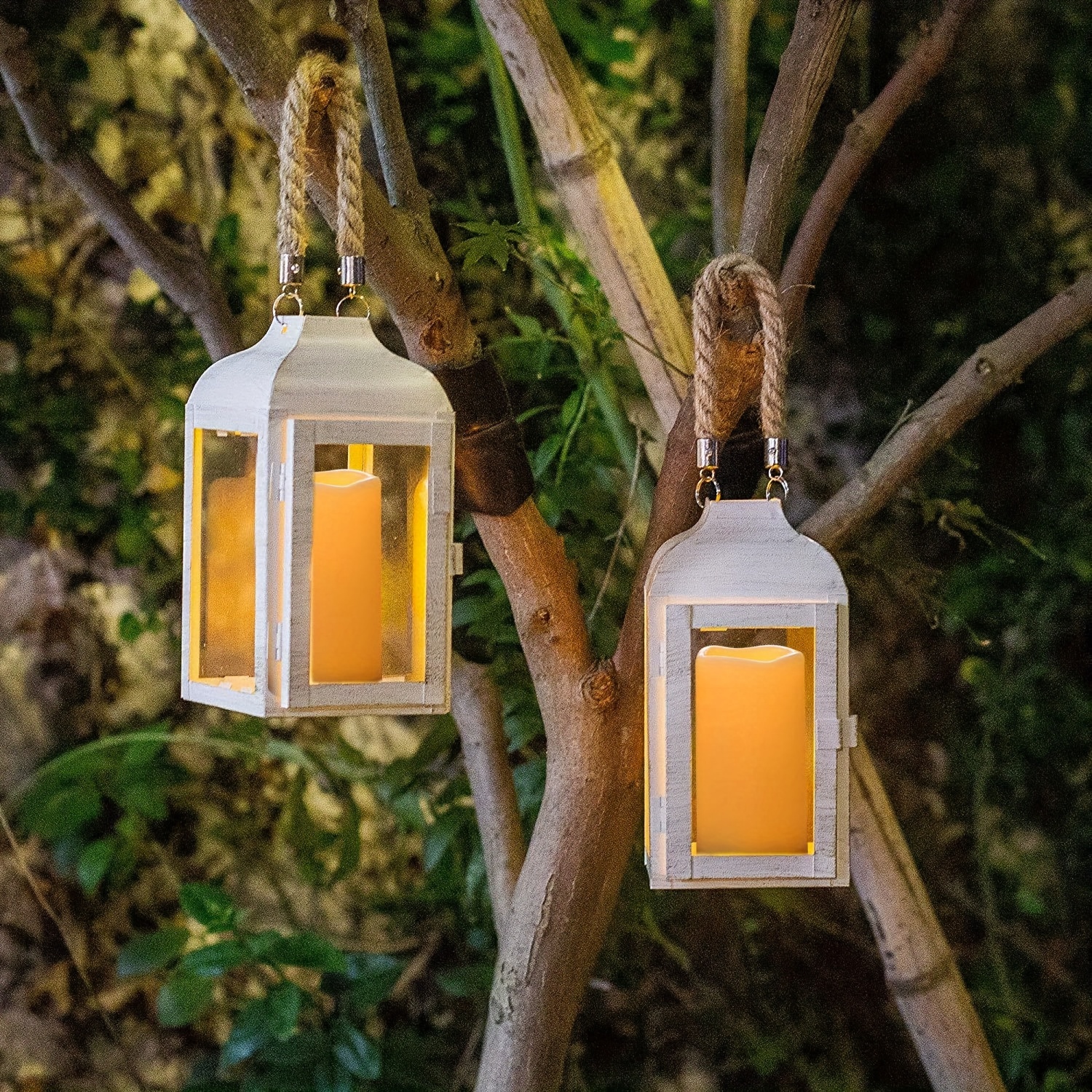 Lanterns suspended from trees.. use led remote control candles