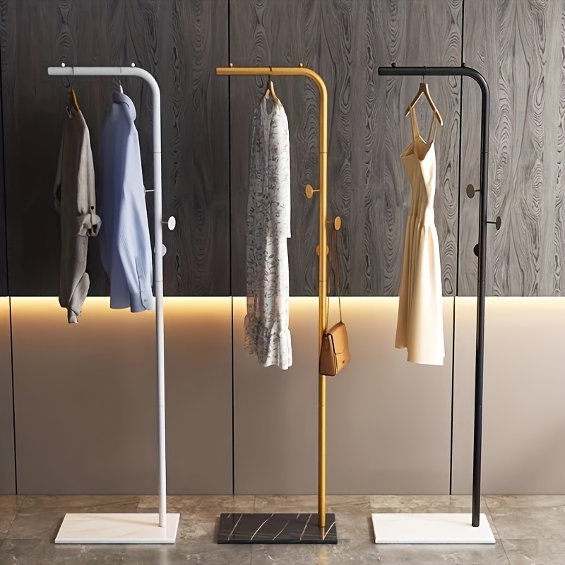 13 tendederos verticales para secar la ropa en interior ahorrando espacio