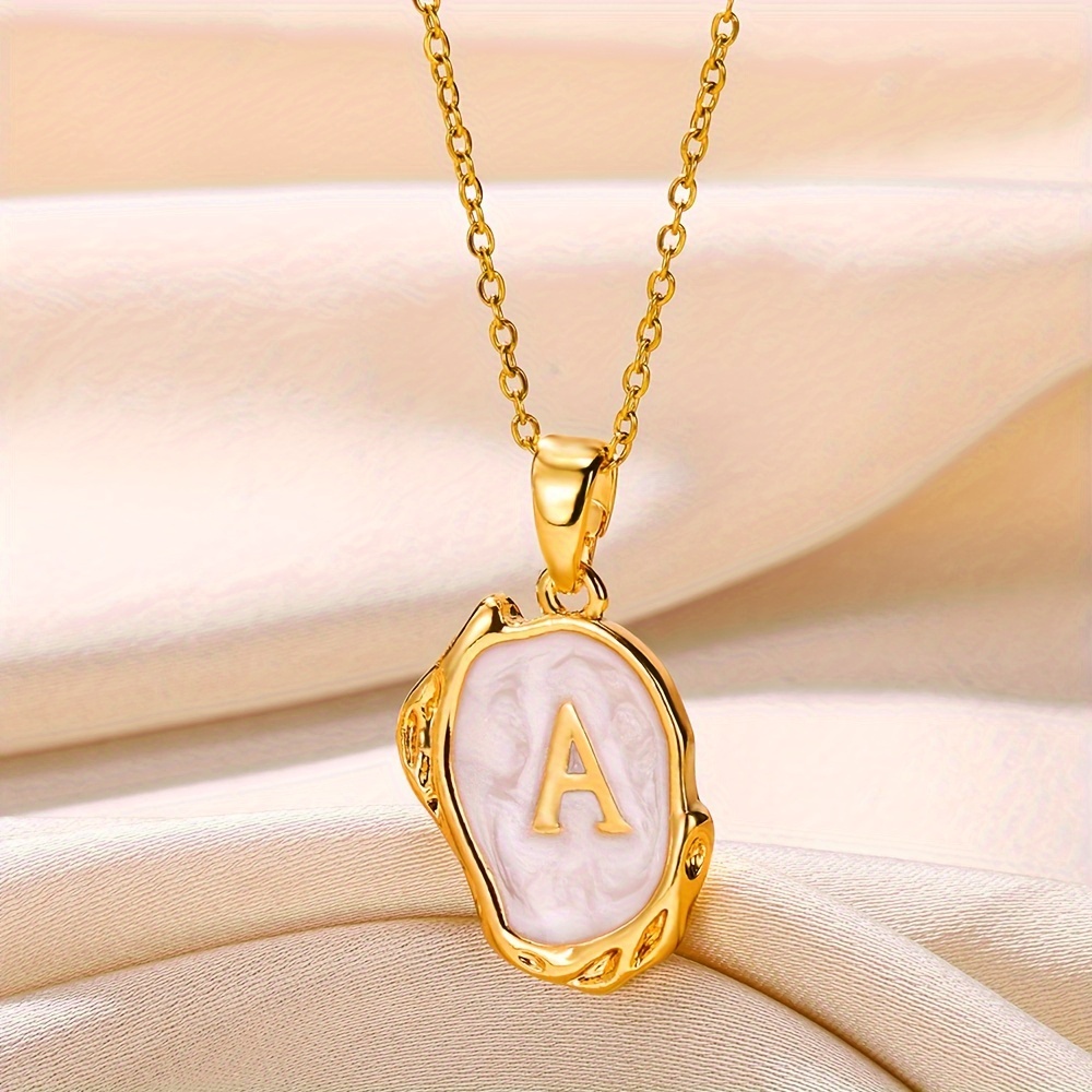 A alphabet hot sale gold locket