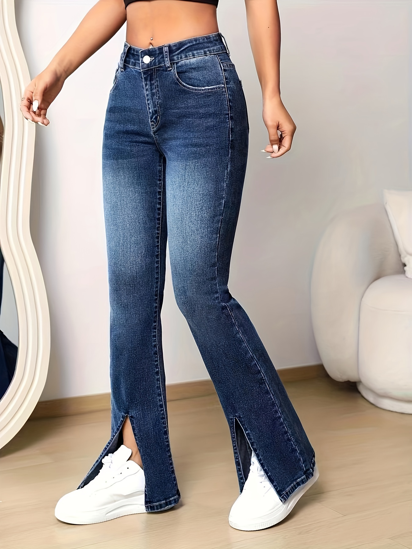 Flared jeans with slit hem