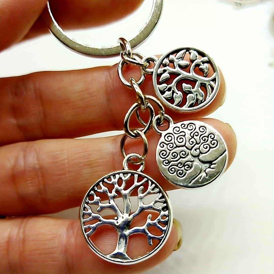 A Keychain Featuring 3 Stylish And Beautiful Christmas Trees