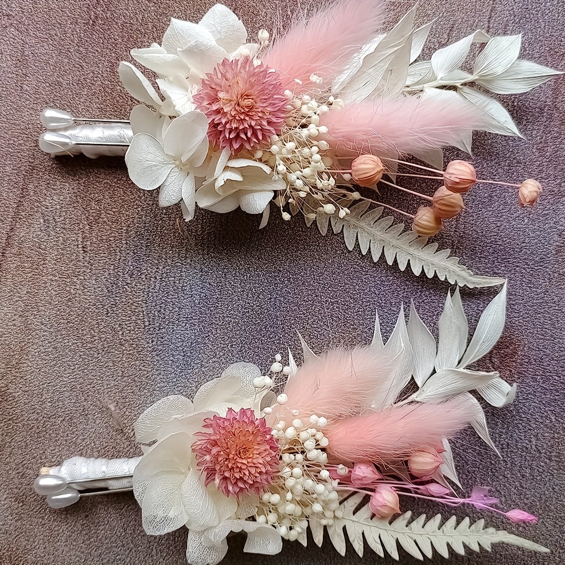 Groom boutonniere with feather and dried wildflowers in boho style