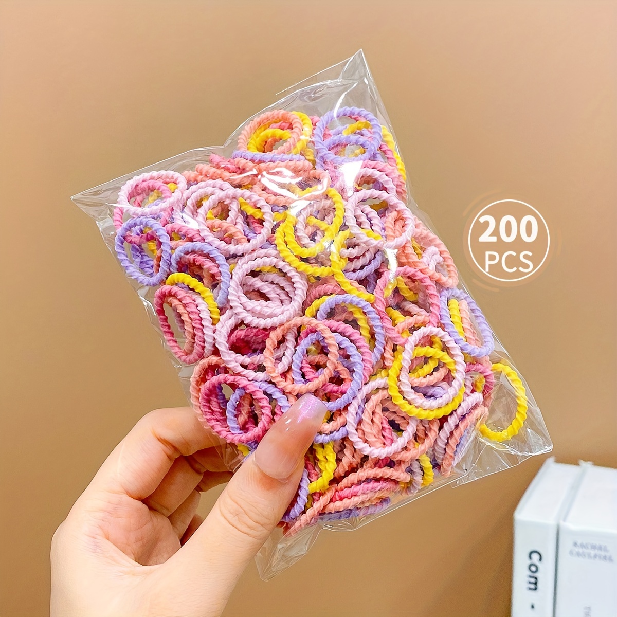 Paquete de 200 gomas para el cabello para niñas de color caramelo