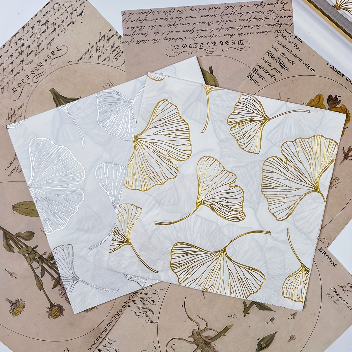 

16 Pieces Of 2-ply White Napkins With Golden And Silvery Ginkgo Leaf Pattern, Suitable For Decorating Weddings, Birthdays, Tea Parties, Restaurants, Hotels, And Cafes, Measuring 13x13 Inches.