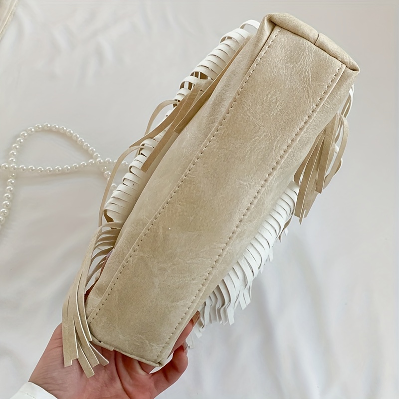 Worth the Tassel Crossbody Cream