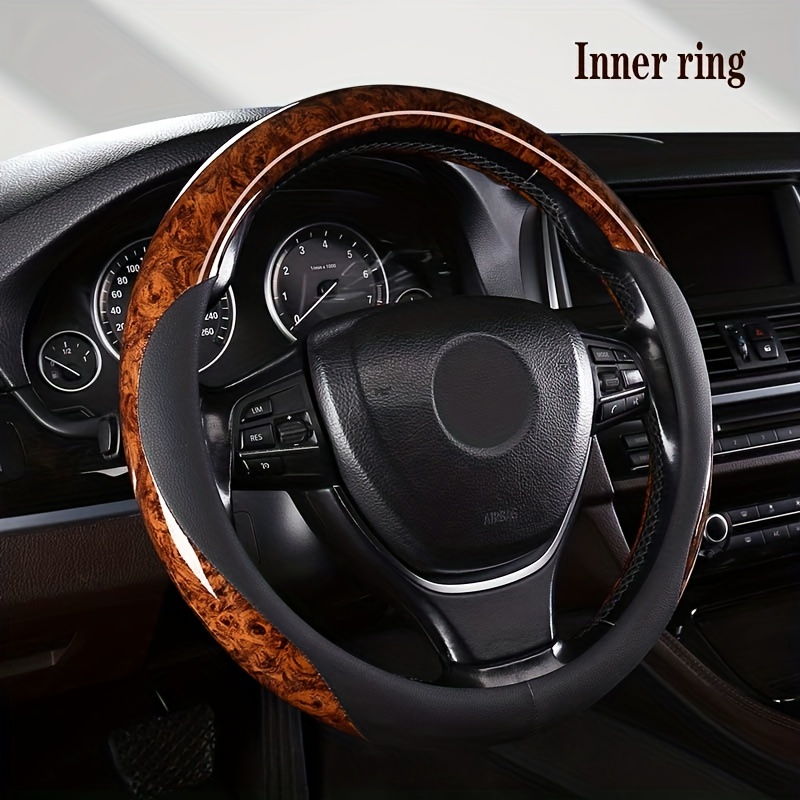 

Upgrade Your Ride With A Genuine Leather Steering Wheel Cover - Non-slip, Sweat-absorbing, And Peach Wood Grain Design!