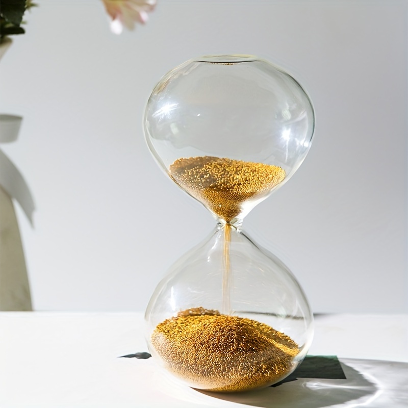 Reloj de arena dorado de cristal
