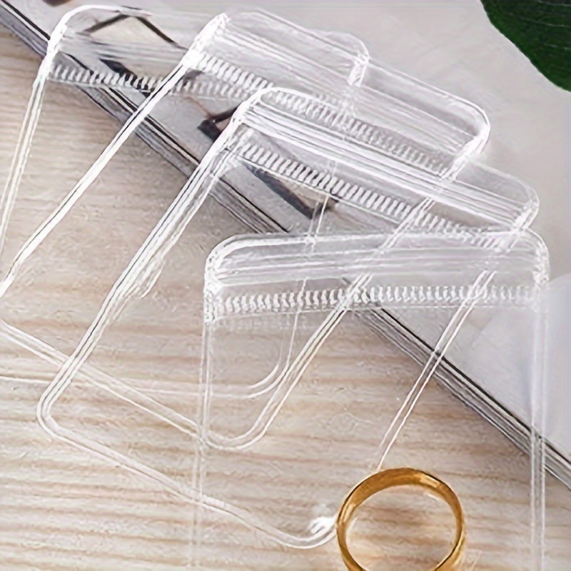  50 bolsas de almacenamiento de PVC para joyas, bolsas pequeñas  con cierre automático, bolsa de anillos transparentes, aretes de embalaje,  bolsas de bloqueo transparentes para sostener anillos, aretes, : Ropa,  Zapatos